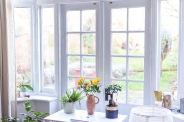 Elegant French doors installed in Milwaukee, WI home by Empire Home Remodeling, offering unobstructed views and airflow